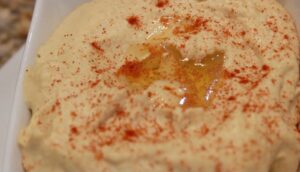 hummus with paprika sprinkled on top
