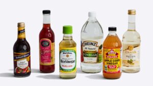 Different types of vinegar in the various bottles 5 different types of bottles rice vinegar braggs vinegar