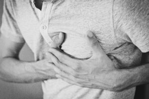 chest pain with a man holding his chest