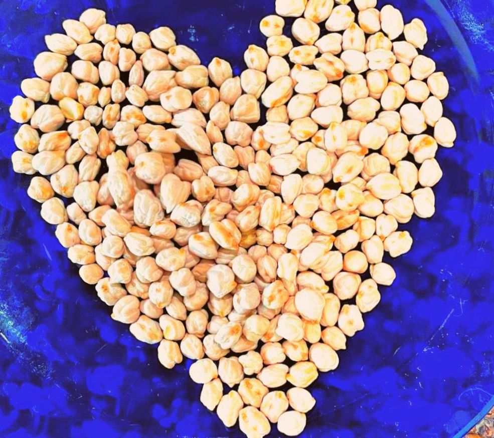 blue plate with chickpea in heart shape