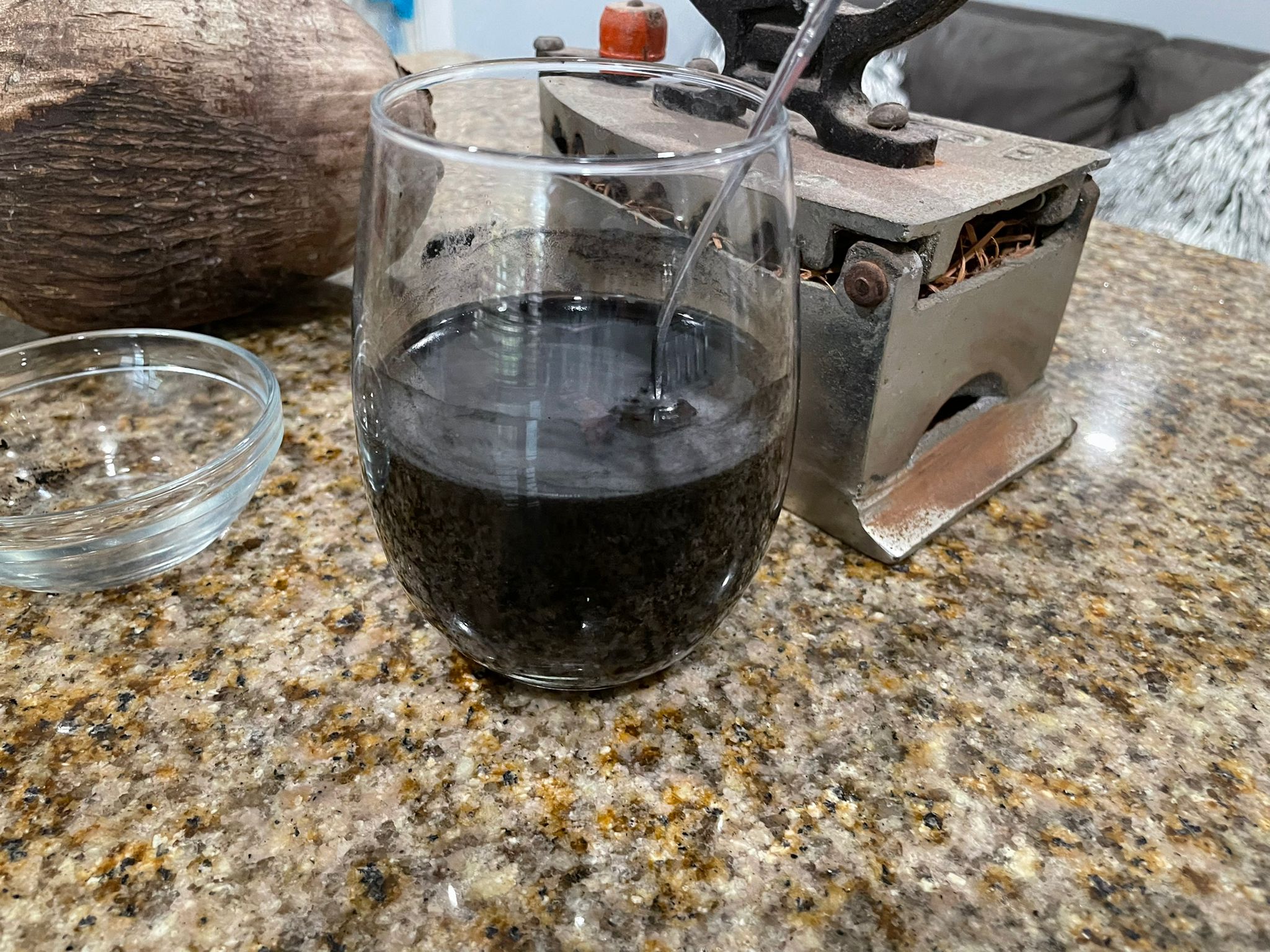 charcoal in water with a coconut and iron