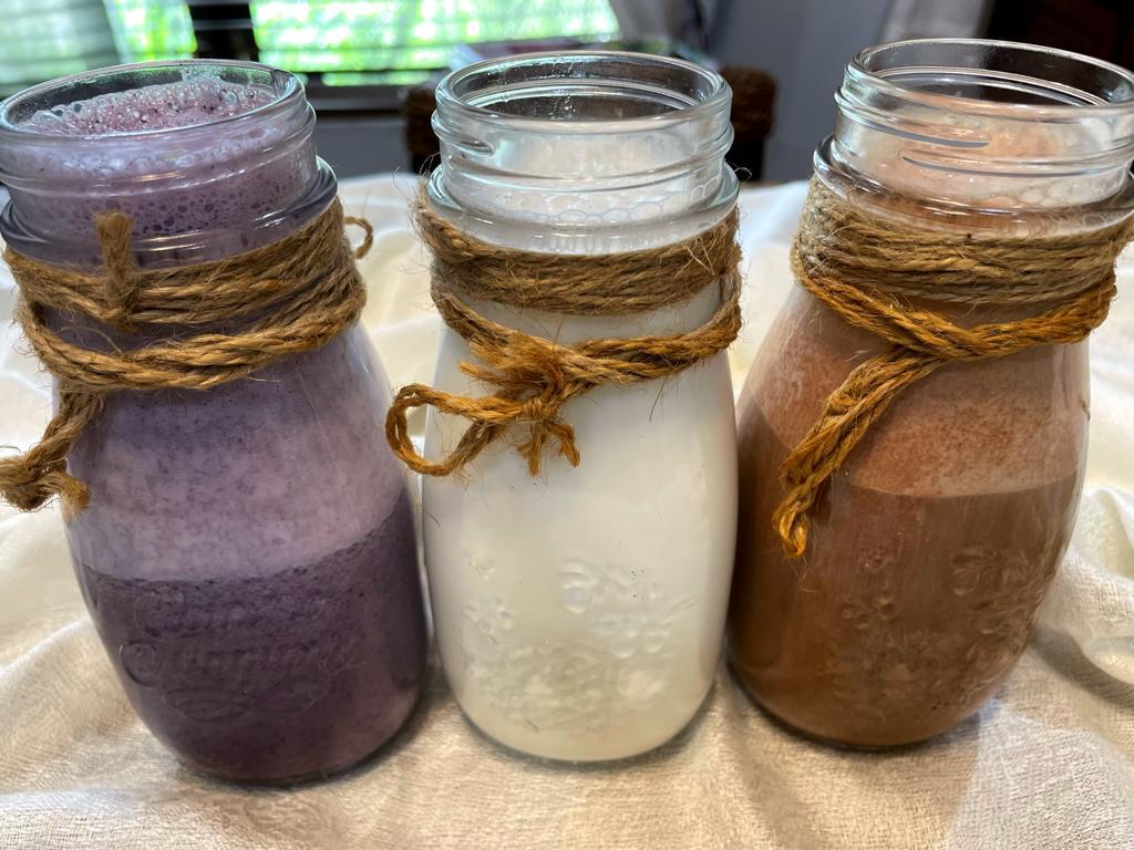 Almond milk in 3 different variety carob, plain and blueberry