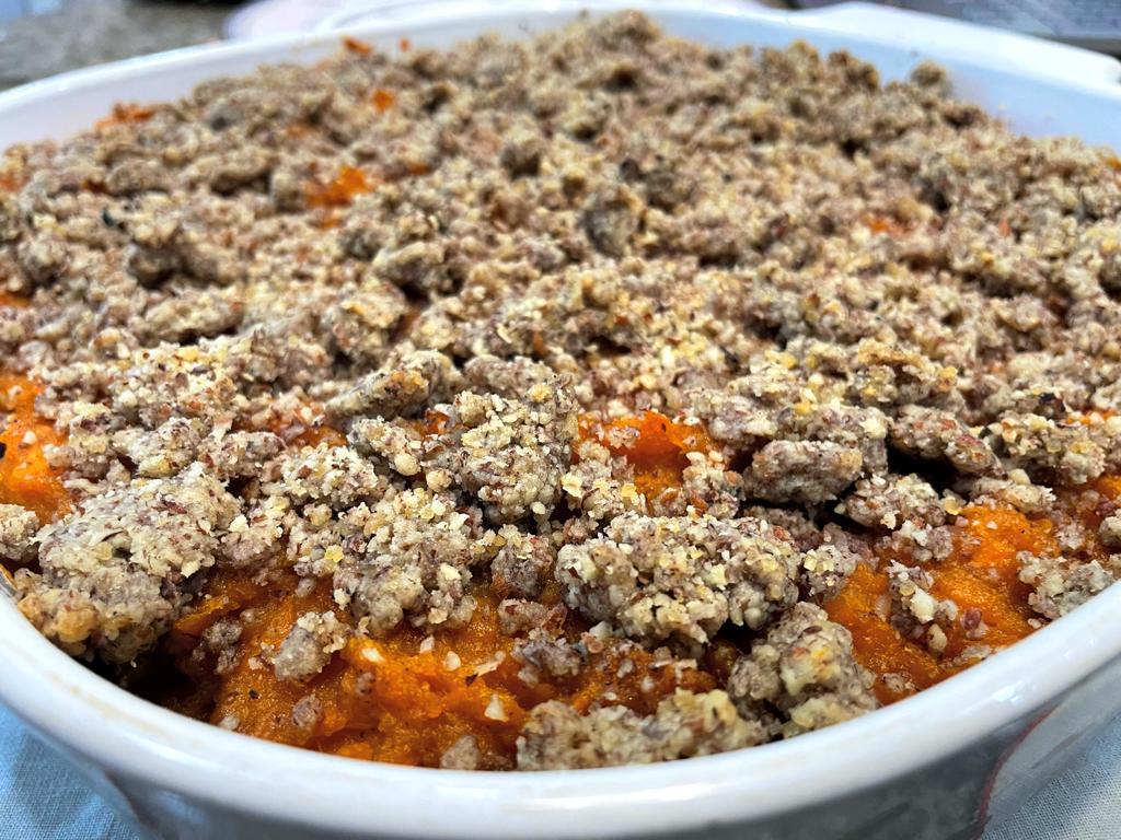 vegan sweet potato casserole baked with a topping of pecan meal and flour with a plant-based spread