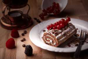 chocolate roll with fruits and whipped topping