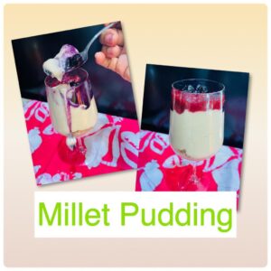Millet pudding in a clear glass with fruits on top on a red and white towel and a black background