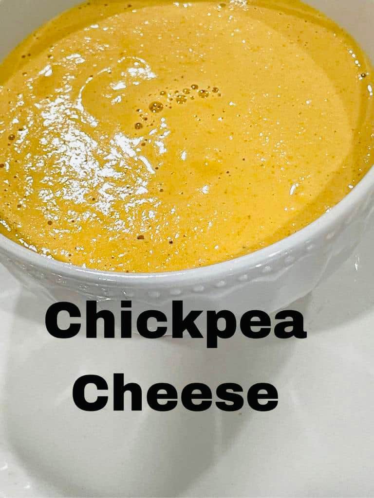 chickpea cheese sauce on a white paste in a white bowl