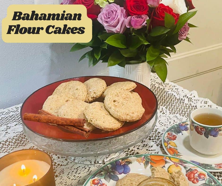 flour cakes on a red plate with yellow flowers on 2 opposite ends with cinnamon sticks